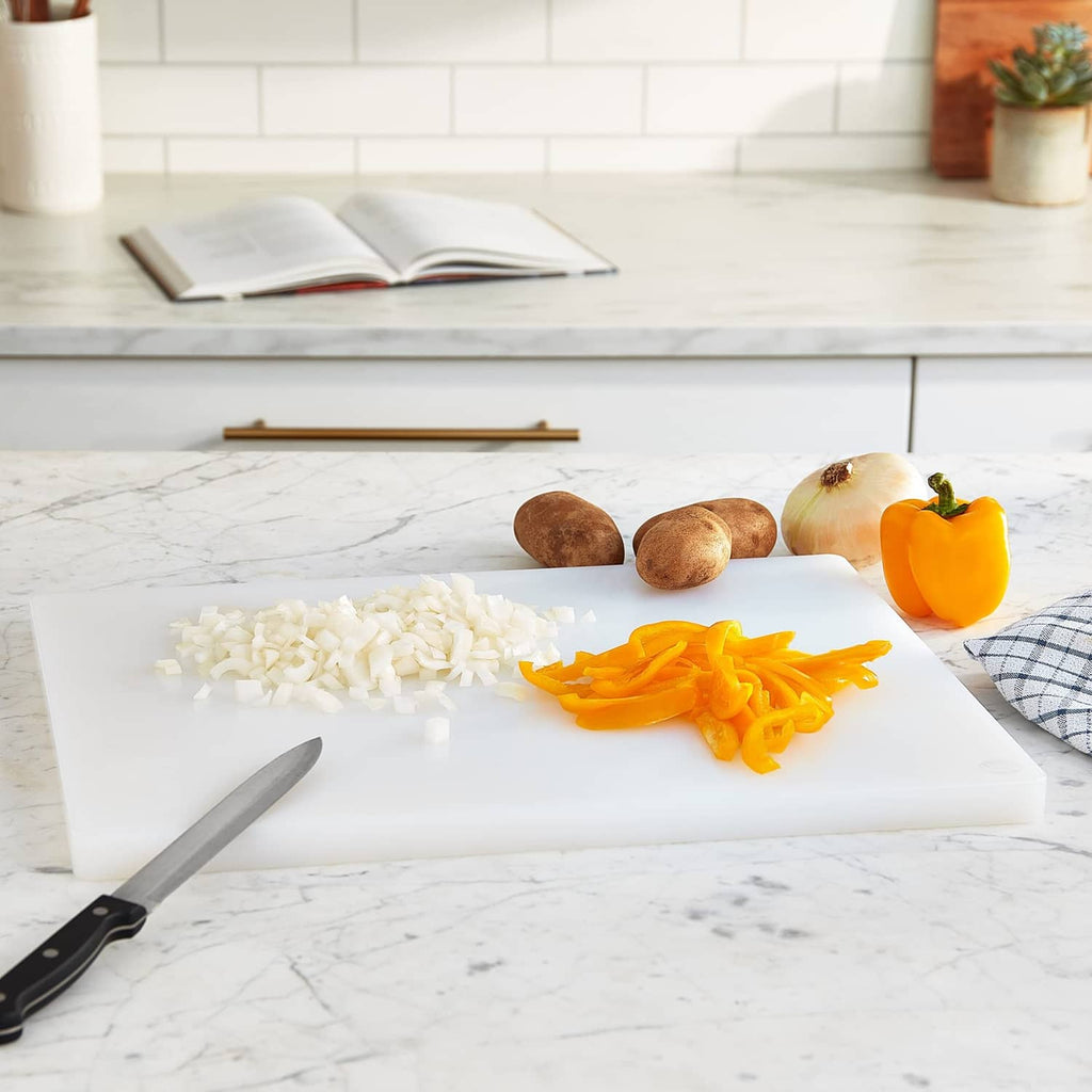 White plastic cutting board on countertop, ready for chopping