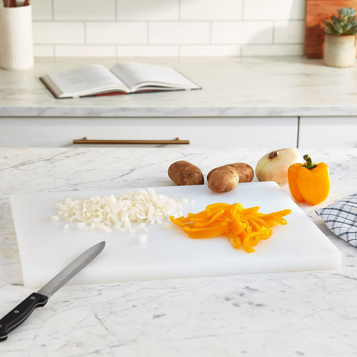 White plastic cutting board on countertop, ready for chopping