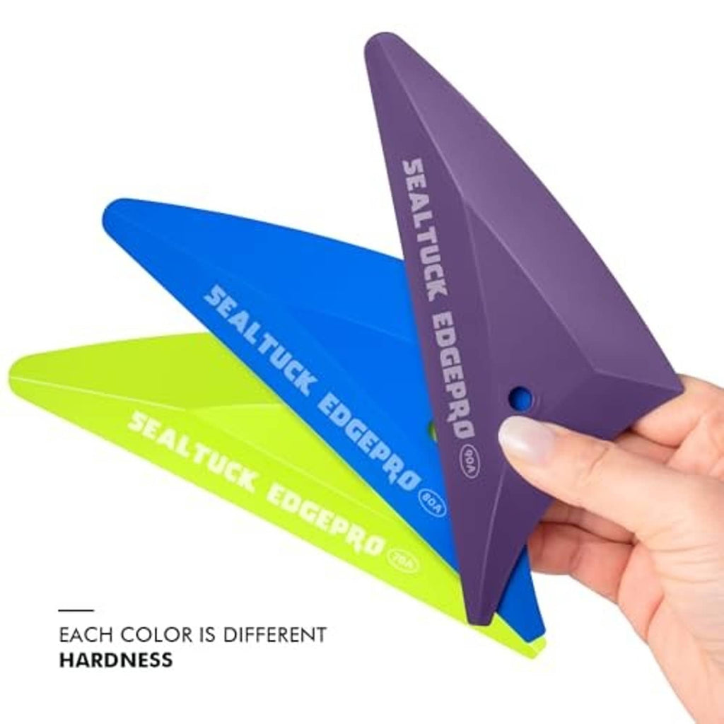 Triangle window tint squeegee set held in hand with purple, blue, and lime pieces