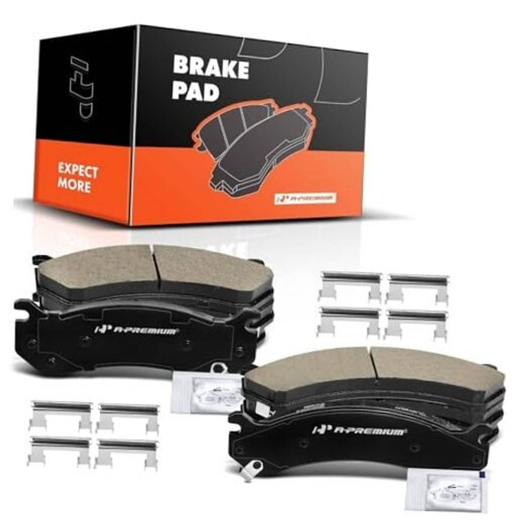 Ceramic front brake pads set with four dark gray pads and mounting hardware