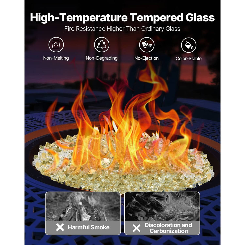 Gold fire pit glass rocks spread in a round fire pit with flames