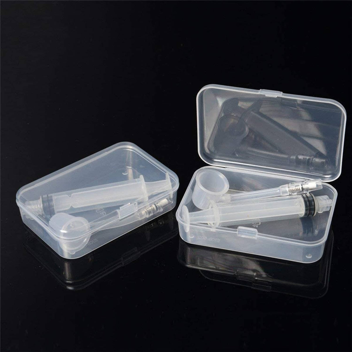 Nipple corrector devices in clear plastic storage case with two syringes and tubes