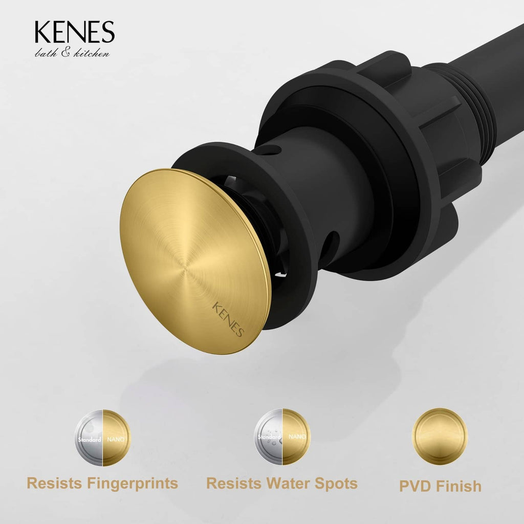 Brushed gold pop-up drain cap on black drain assembly