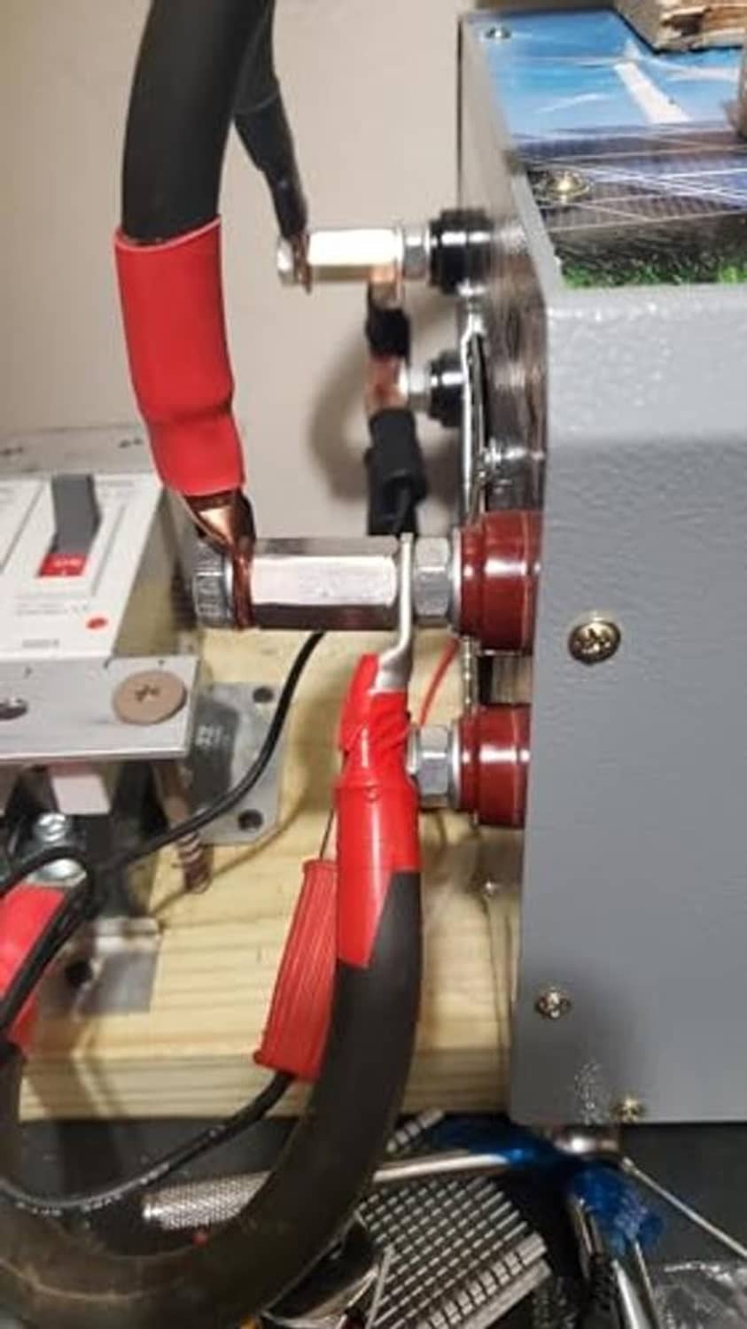 Stainless steel coupling nuts in a metalworking setup beside a lathe tool