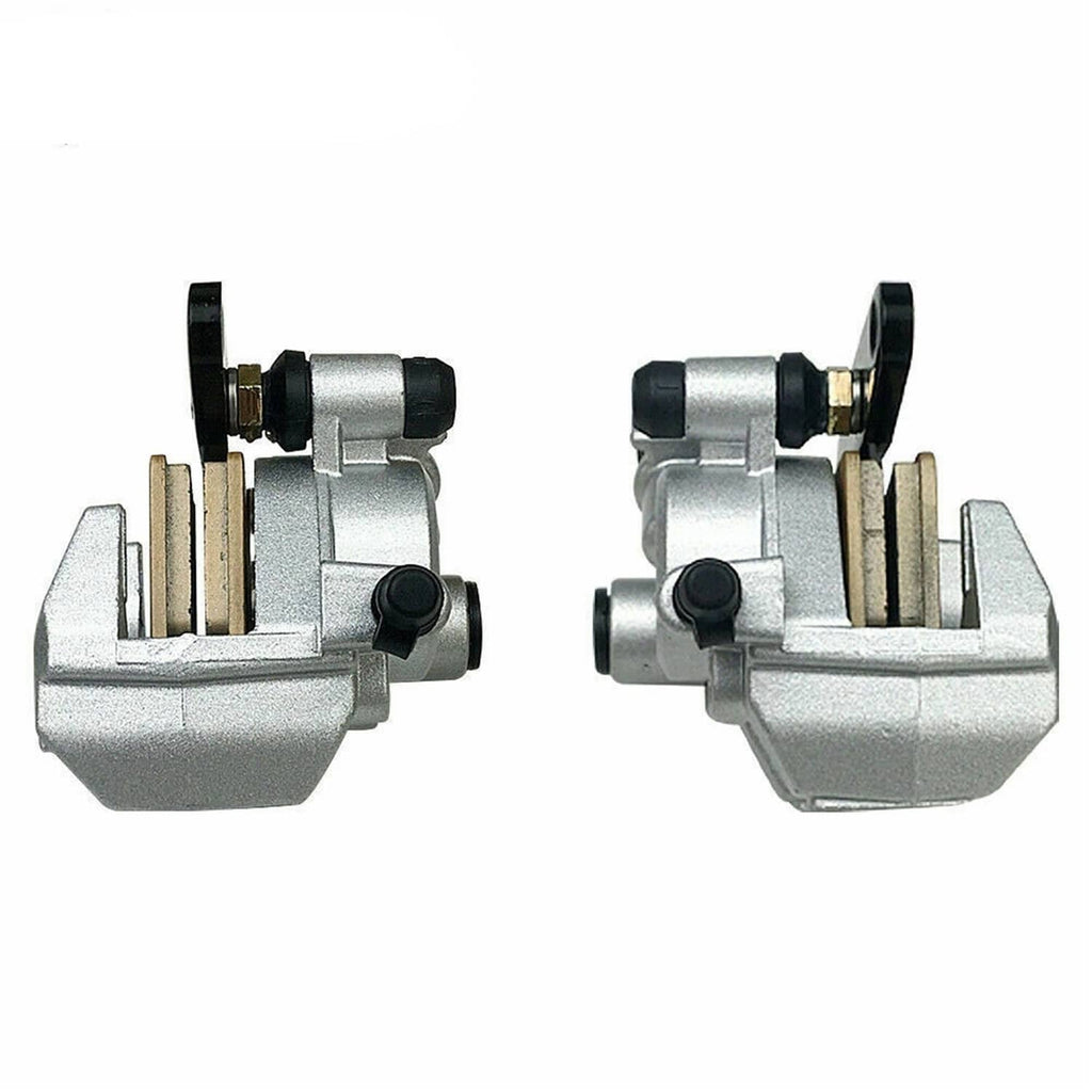 Front brake caliper assembly pair, silver housing with black hoses and brake pad area