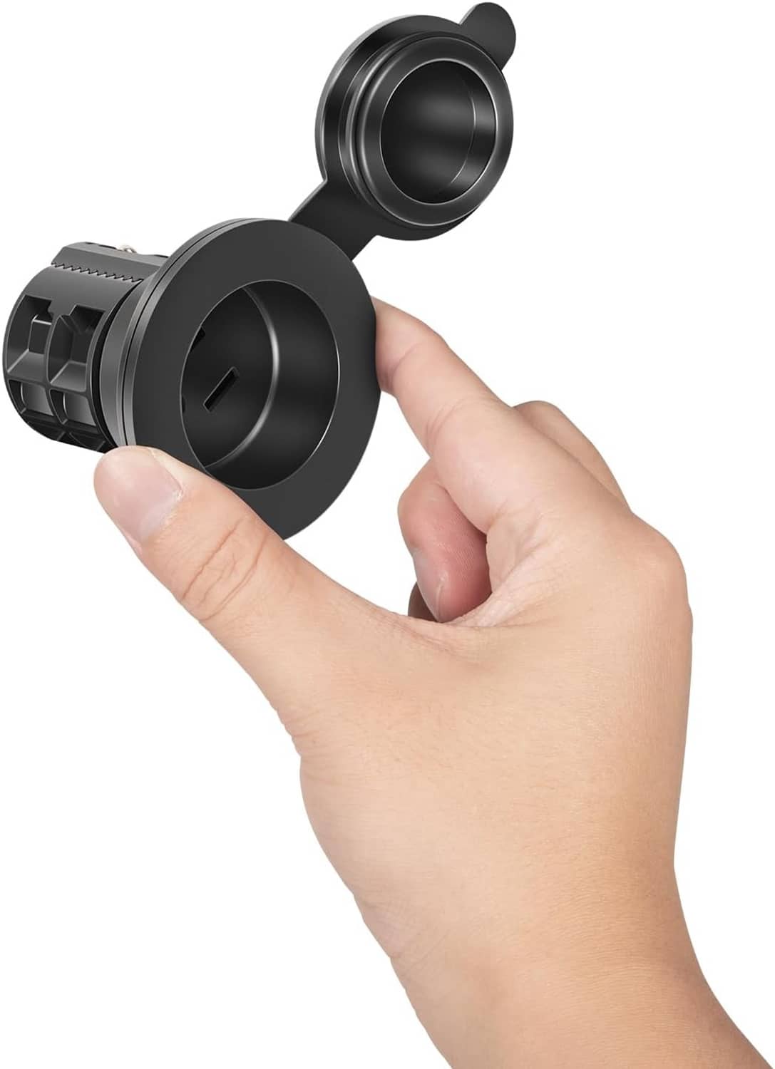 Black AC power port shown with finger holding cover for secure mounting