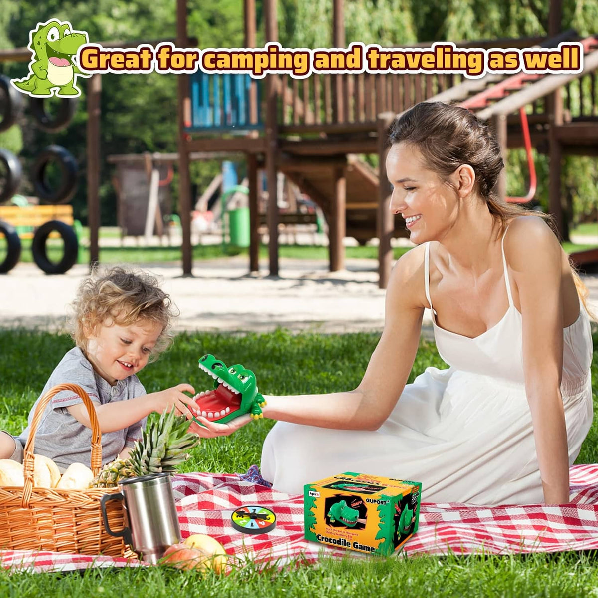 Kids on a picnic playing crocodile tooth dental game with green toy and box