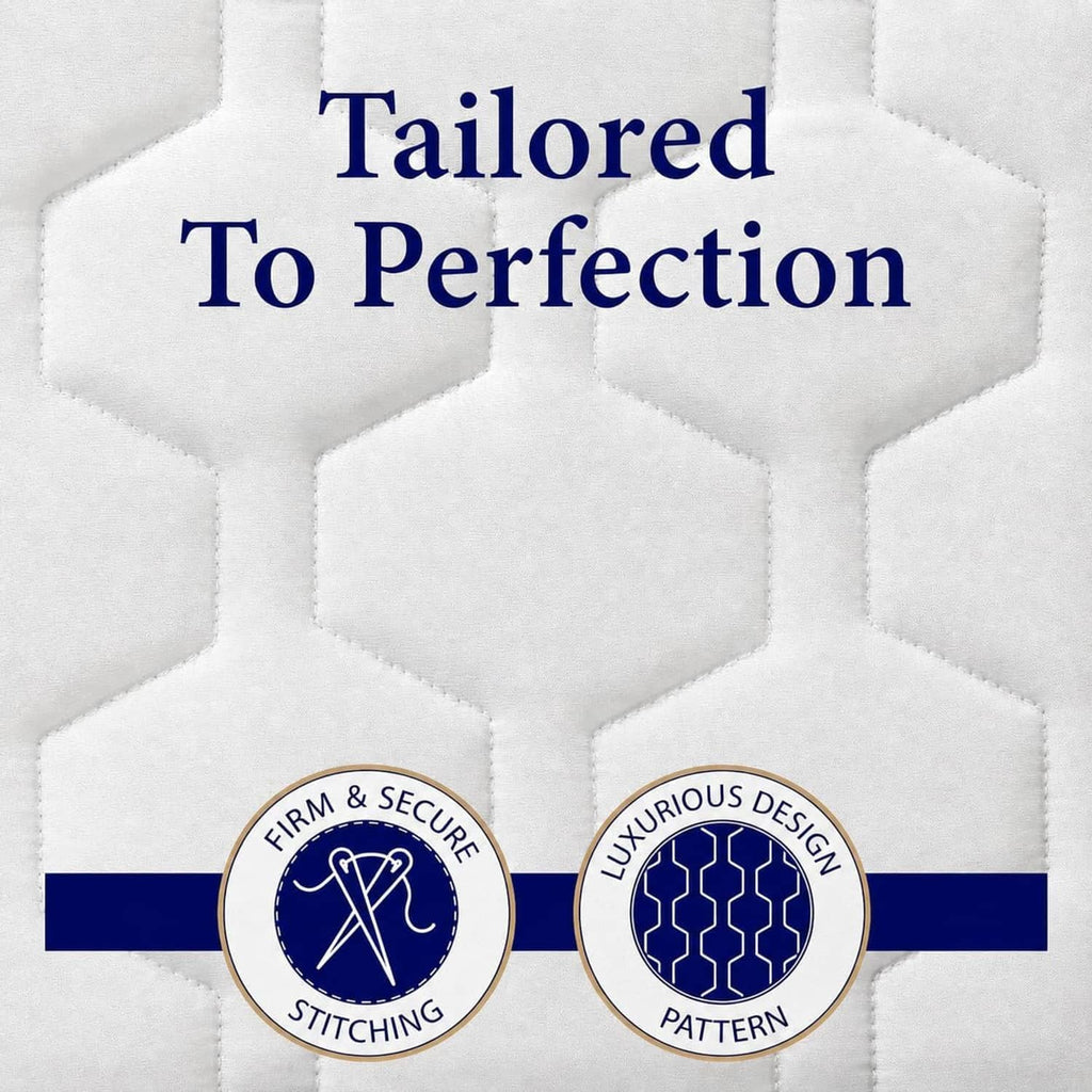 Close-up of white mattress pad quilting with stitched hex-patterned surface