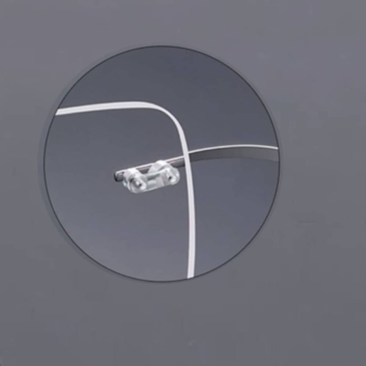 Rimless eyeglass bridge with clear double rubber plug and metal connector