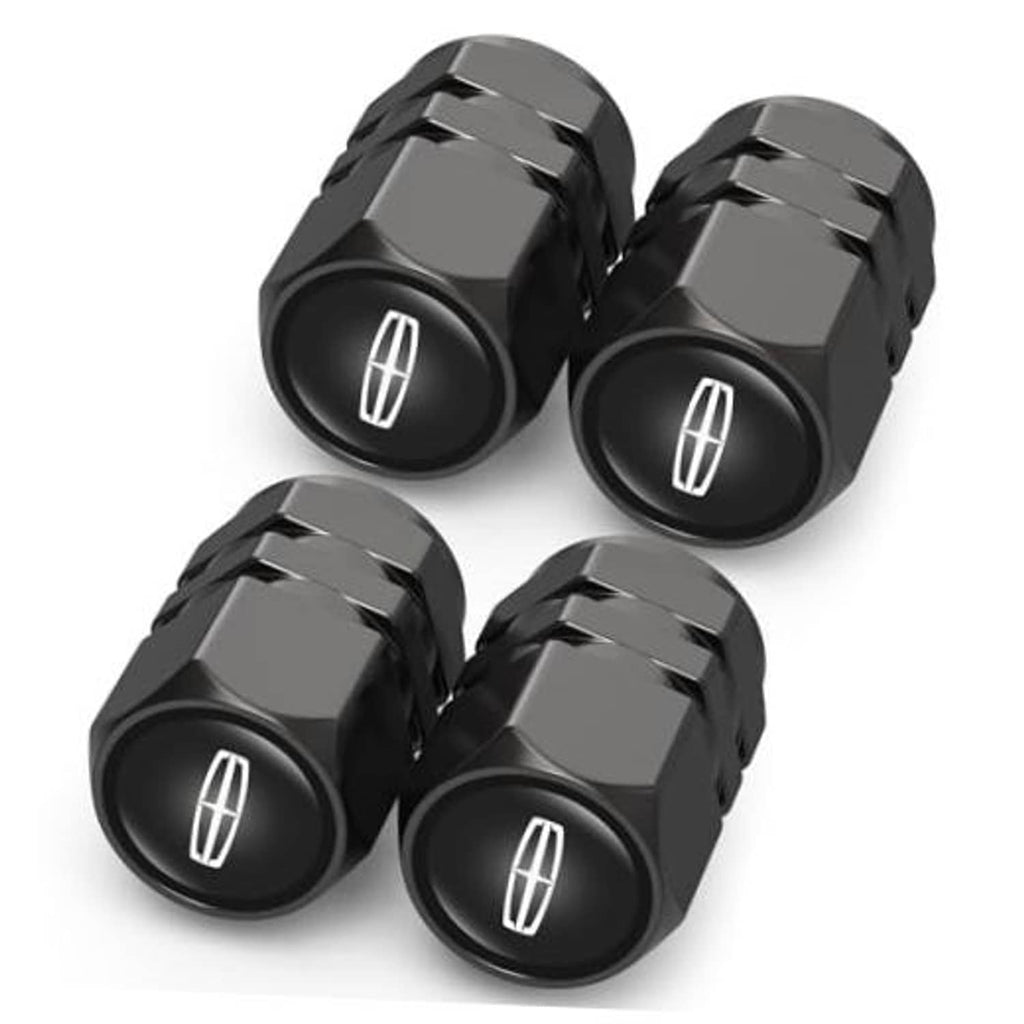 Set of black tire valve stem caps with oval tire symbol, four-piece pack