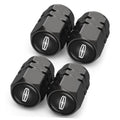 Set of black tire valve stem caps with oval tire symbol, four-piece pack