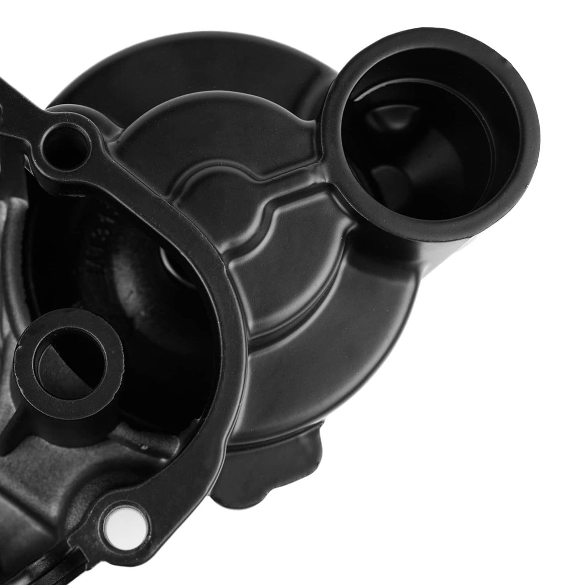 Close-up of black engine crankcase cover with round inlet opening