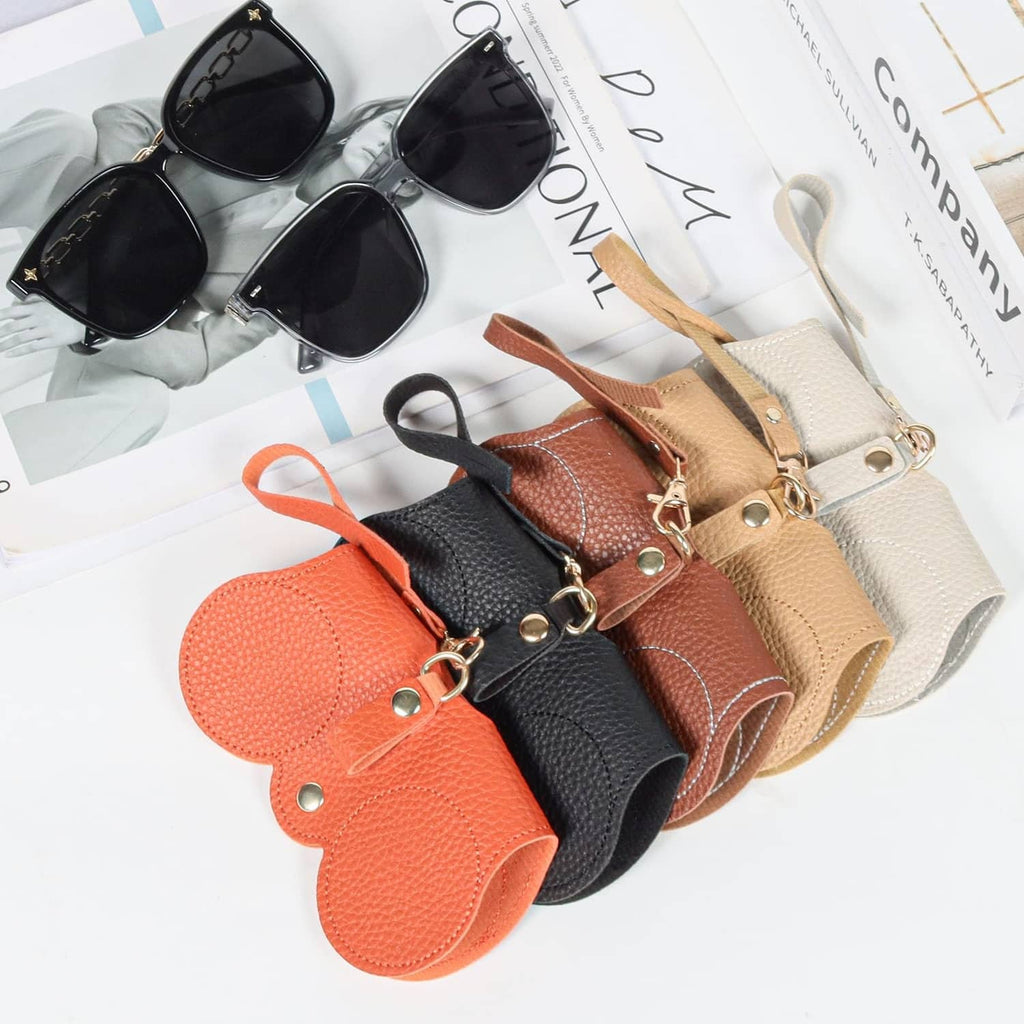 Assorted soft leather sunglasses bags with wrist straps and metal rings, black orange beige