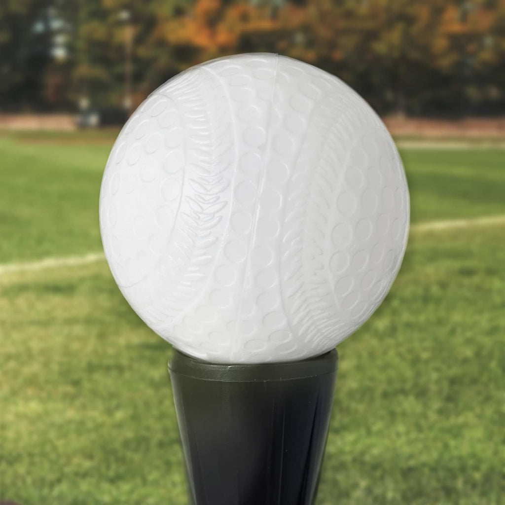 White plastic baseball with raised dimple texture on black base