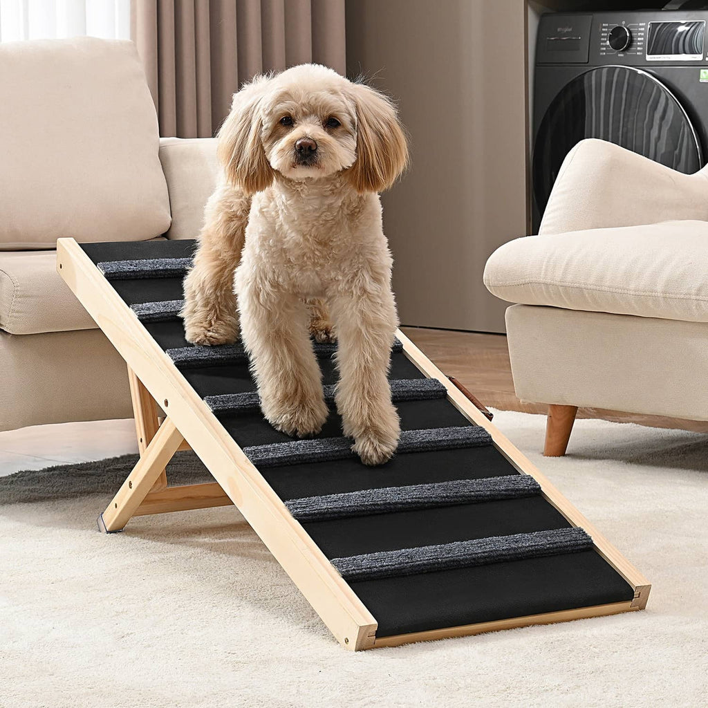 Pet dog ramp with light wood side rails and dark anti-slip steps, dog sitting