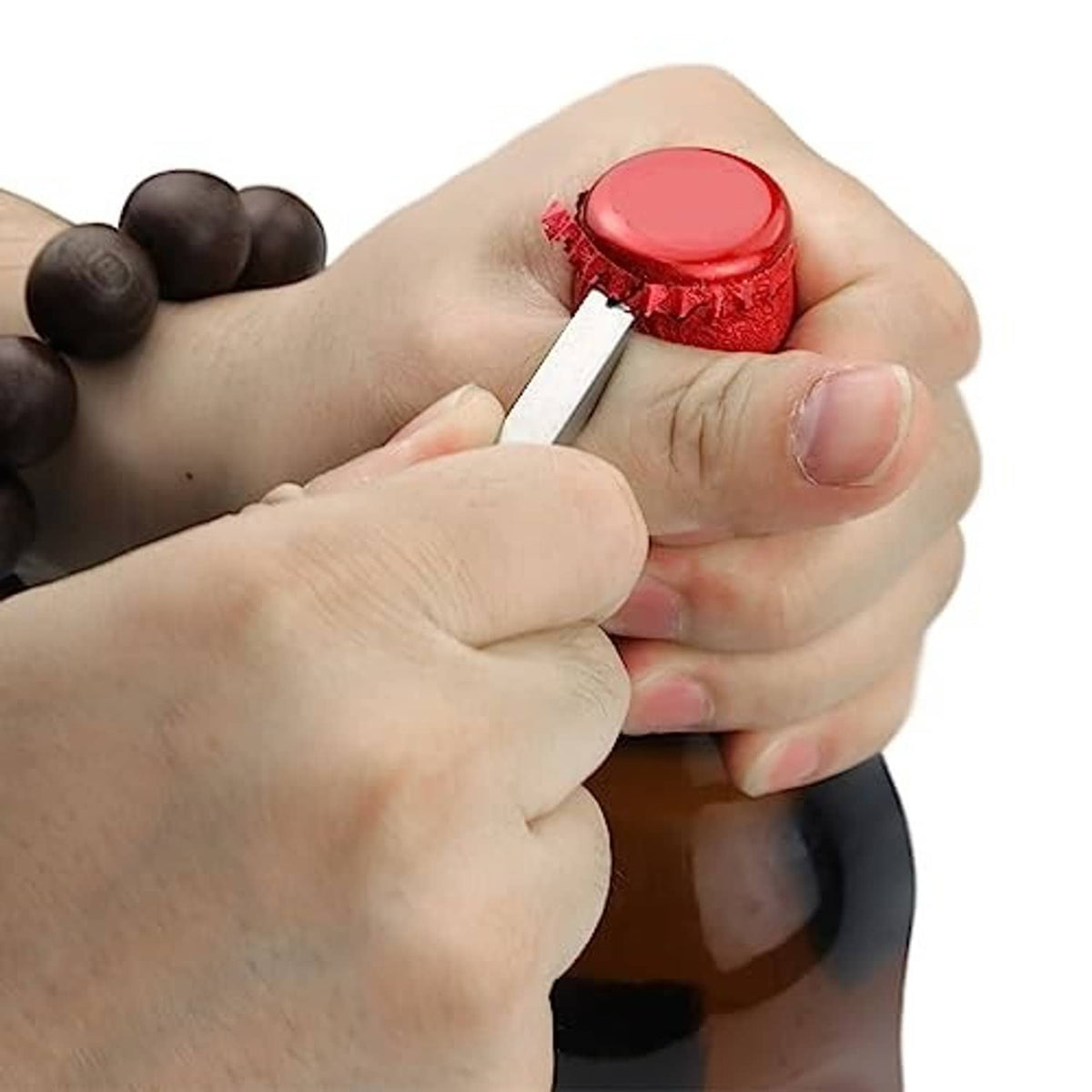 Mini keychain prybar levering off a red bottle cap