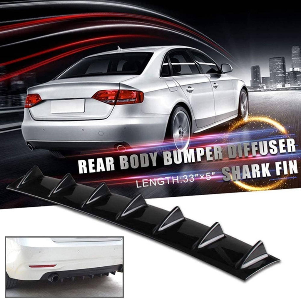 Black shark-style rear bumper lip diffuser mounted on a vehicle rear