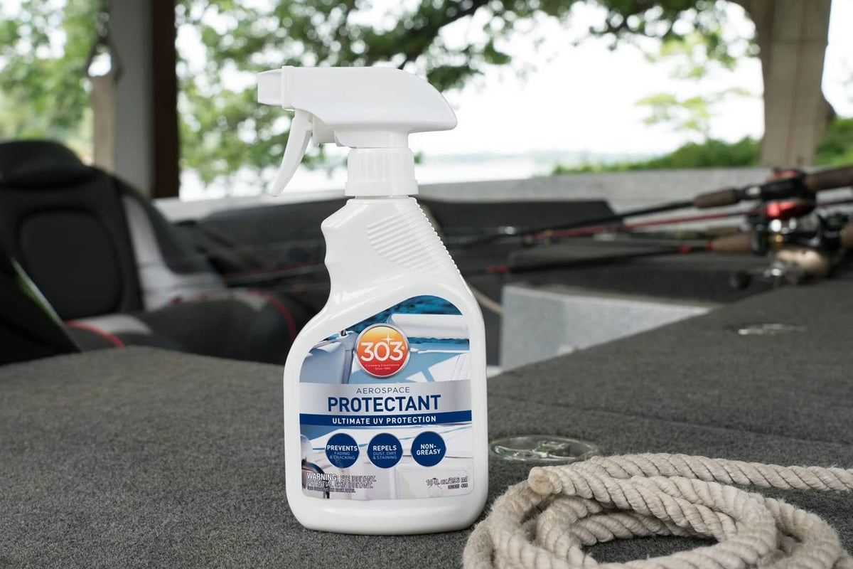 Aerospace protectant spray bottle with white trigger on car seat