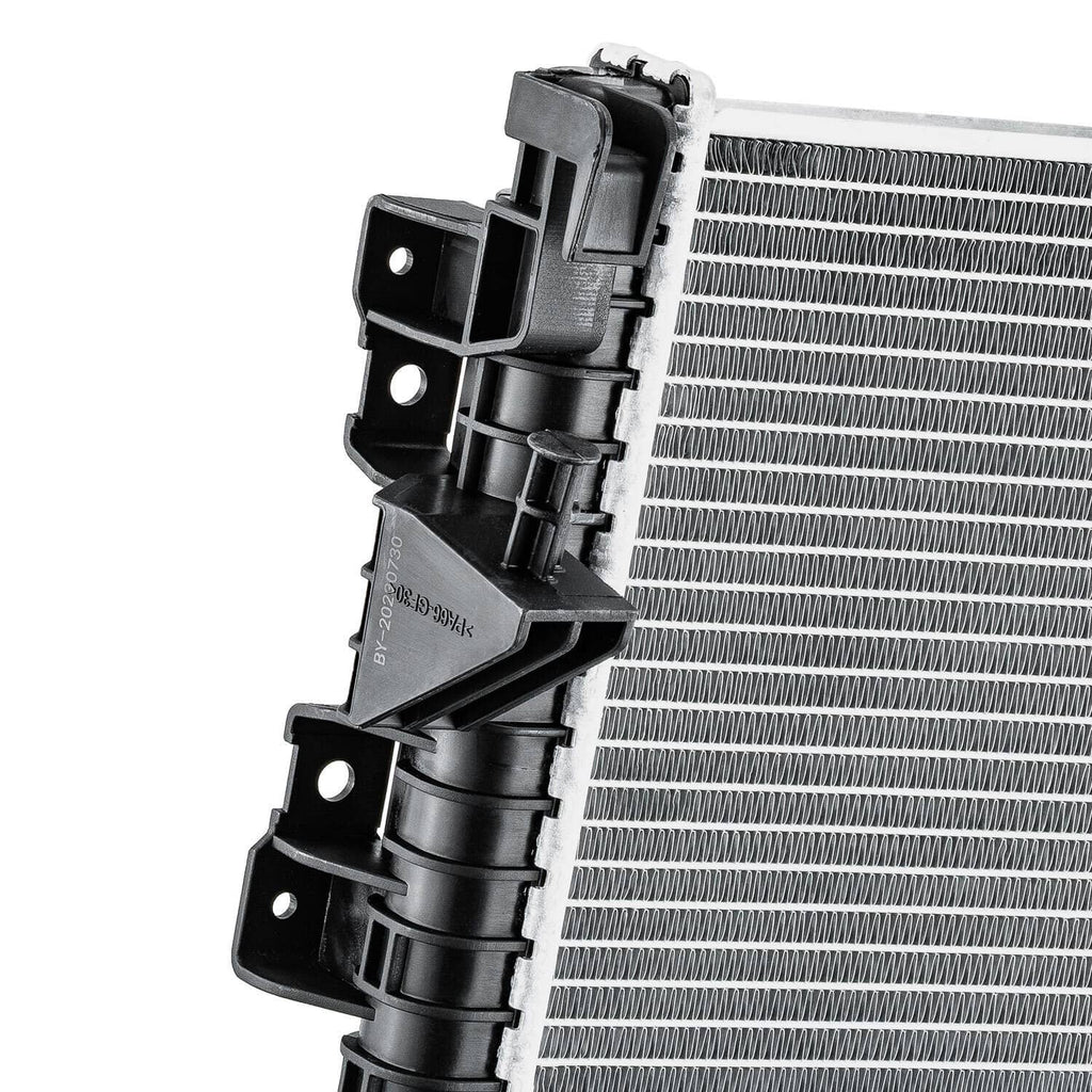 Automotive radiator top bracket detail with black mounting hardware and silver fin core