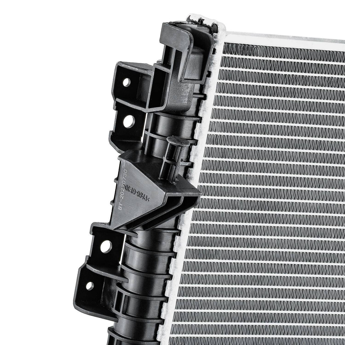 Automotive radiator top bracket detail with black mounting hardware and silver fin core