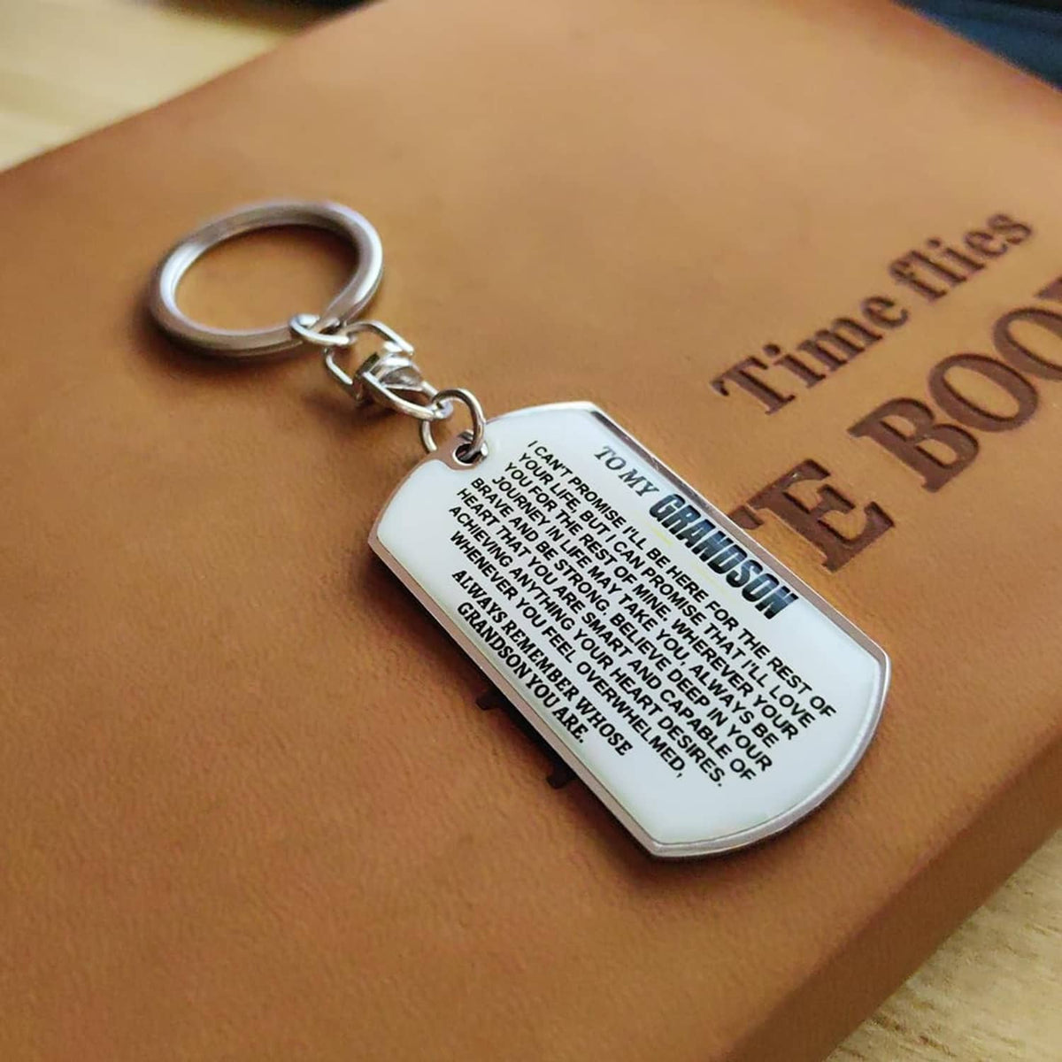 Silver dog-tag keychain with engraved inspirational text and keyring