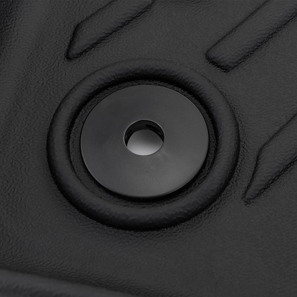 Black floor mat anchor hole with surrounding raised rubber ring