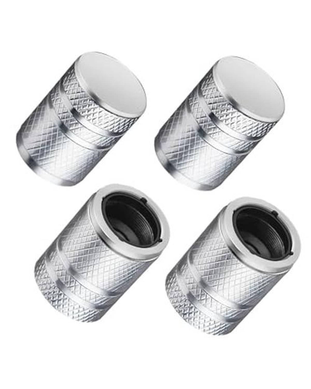 Four silver tire valve stem caps with textured metal body and black rubber liner