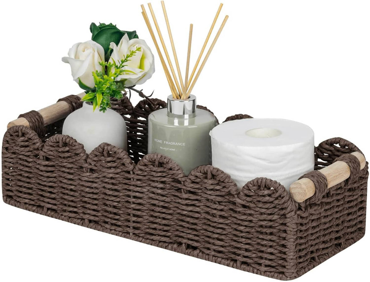 Brown woven toilet paper storage basket with scalloped top and open compartments