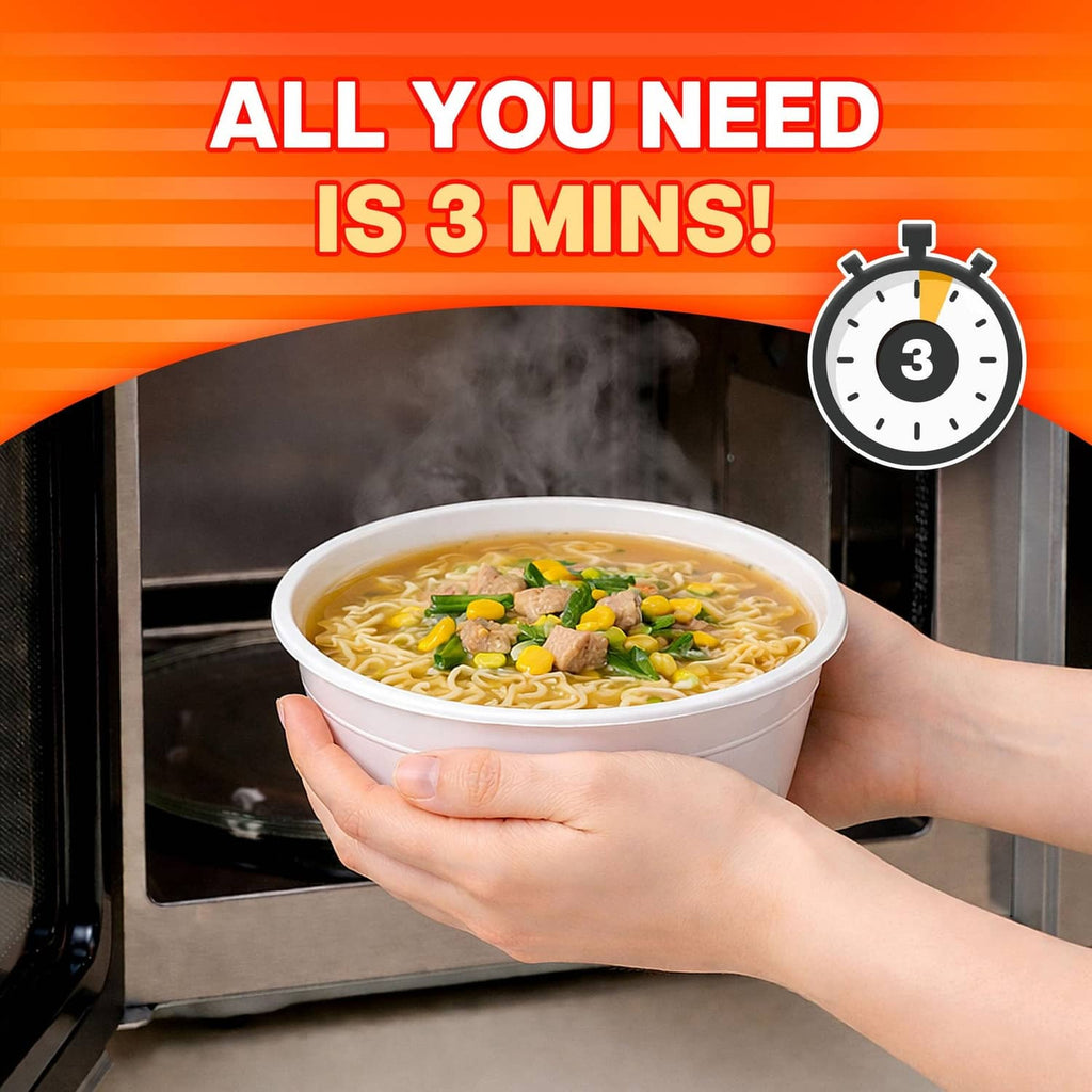Hand holding a cup of savory chicken noodle soup with vegetables and meat
