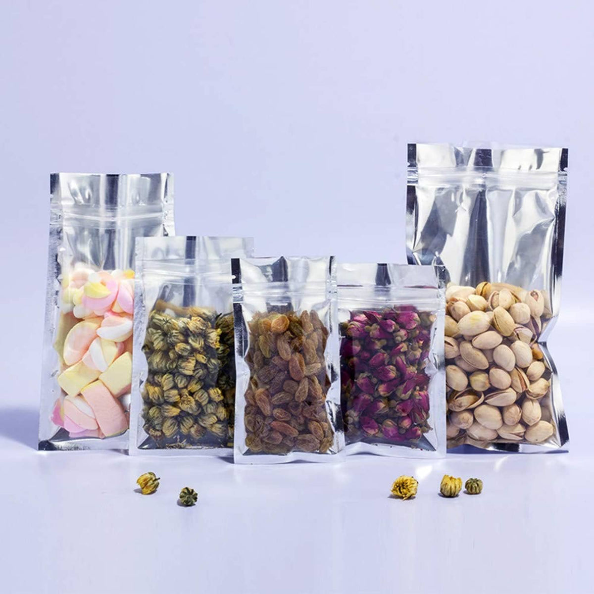 Assorted clear resealable mylar bags with mixed small colorful items inside