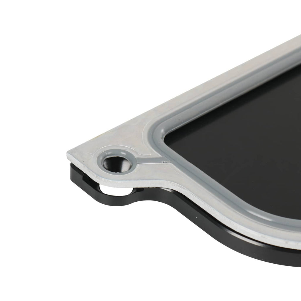 Gasket and cover plate edge with round bolt port, black seal and silver housing