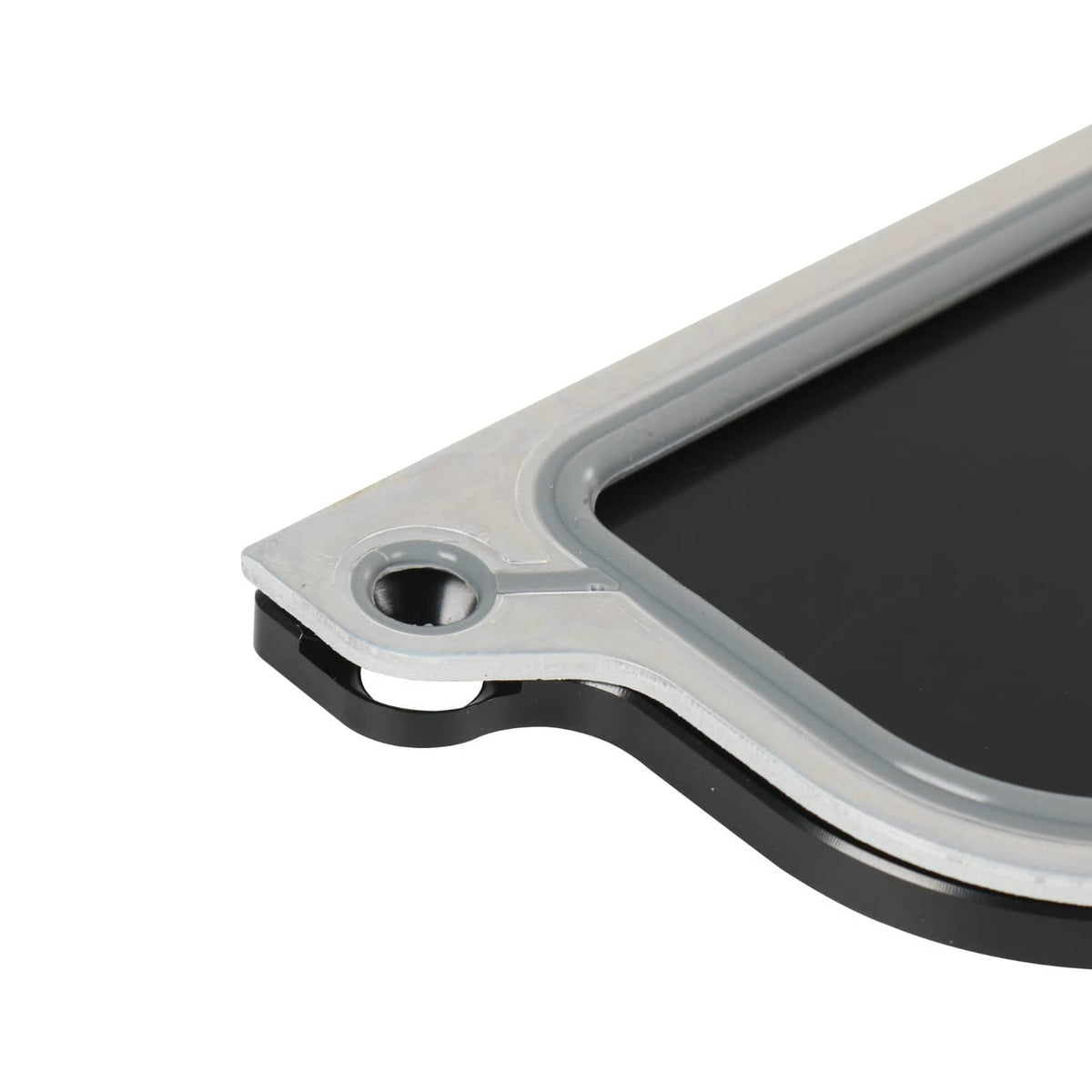 Gasket and cover plate edge with round bolt port, black seal and silver housing