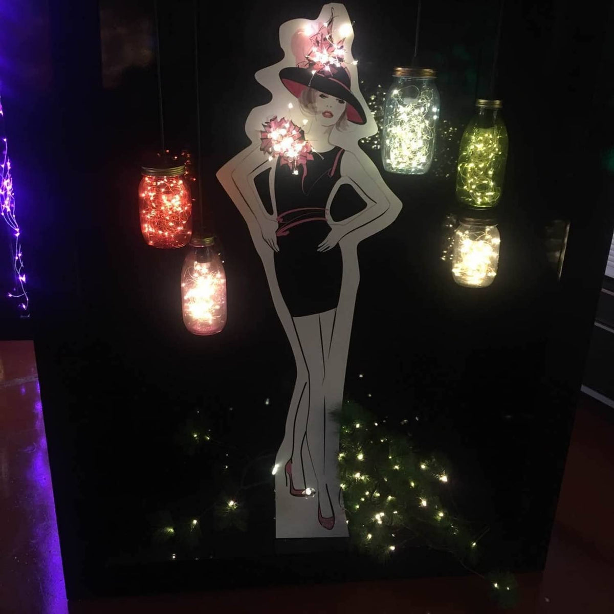 Glowing fairy string lights in hanging jar-shaped lanterns