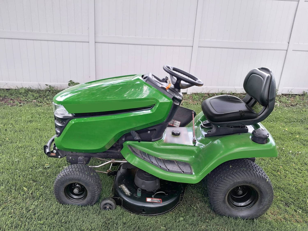 Green lawn tractor front end with installed upper hood, grille, and headlight assembly