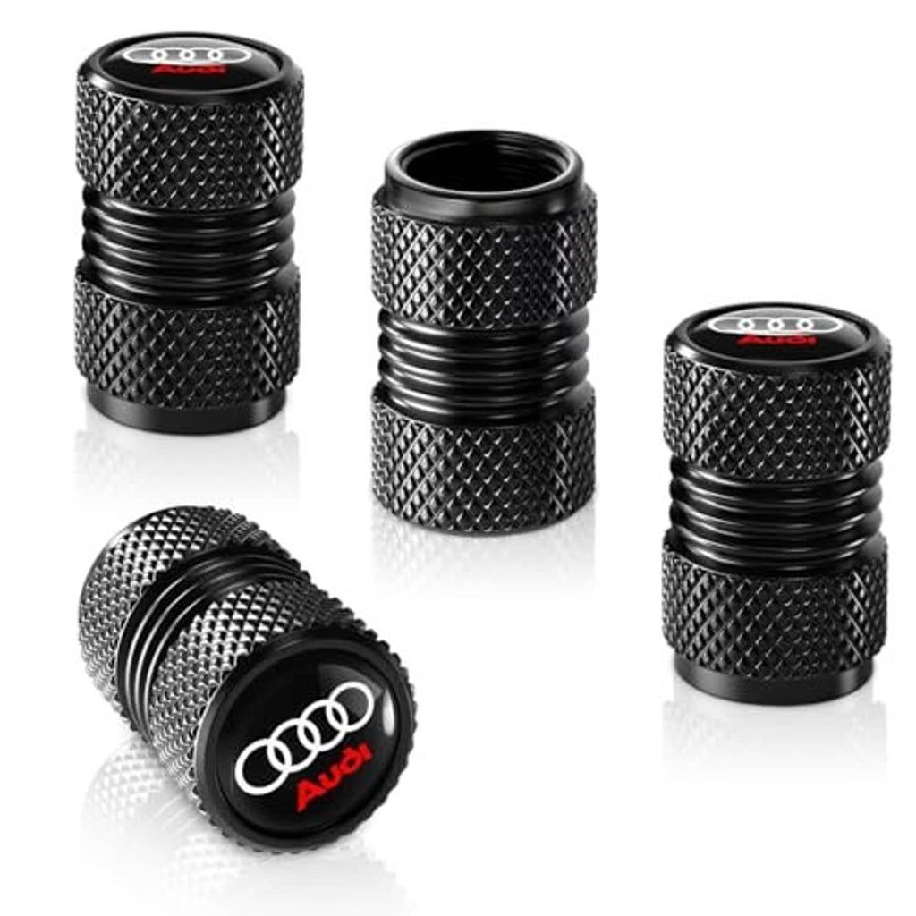 Set of black knurled tire valve stem caps with Audi rings and ridged grip tops