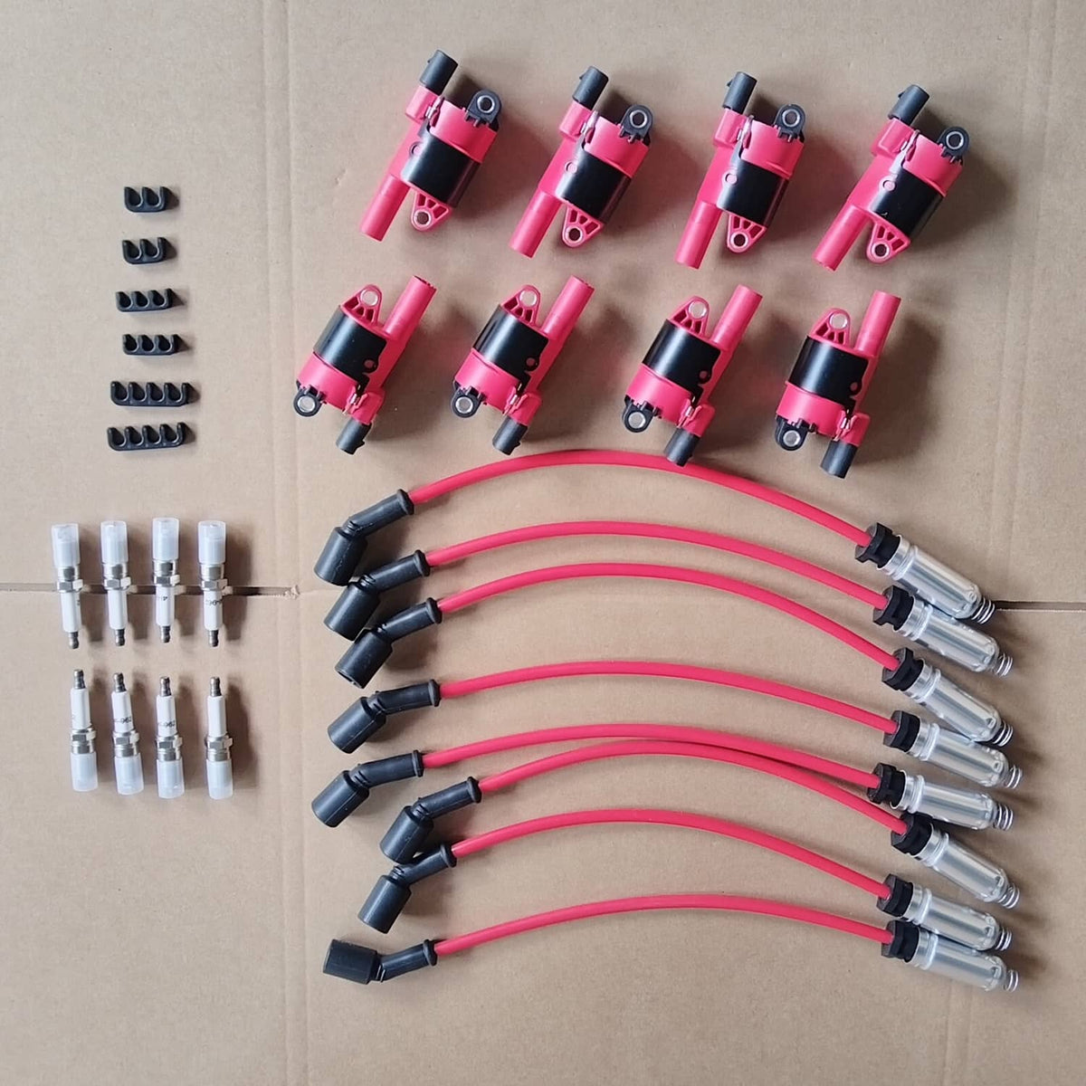 Ignition coil and spark plug wire kit with pink coil packs and connectors