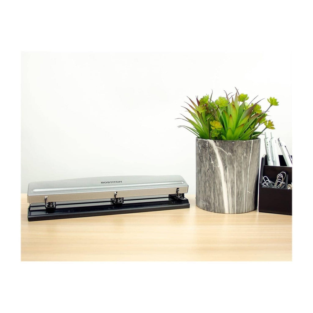 BOSTITCH 3-hole metal office punch with silver top and black base