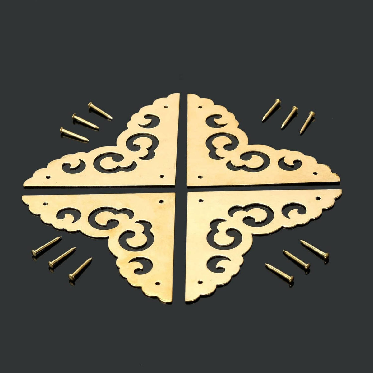 Brass decorative table corner brackets forming a star cross, with screw fasteners