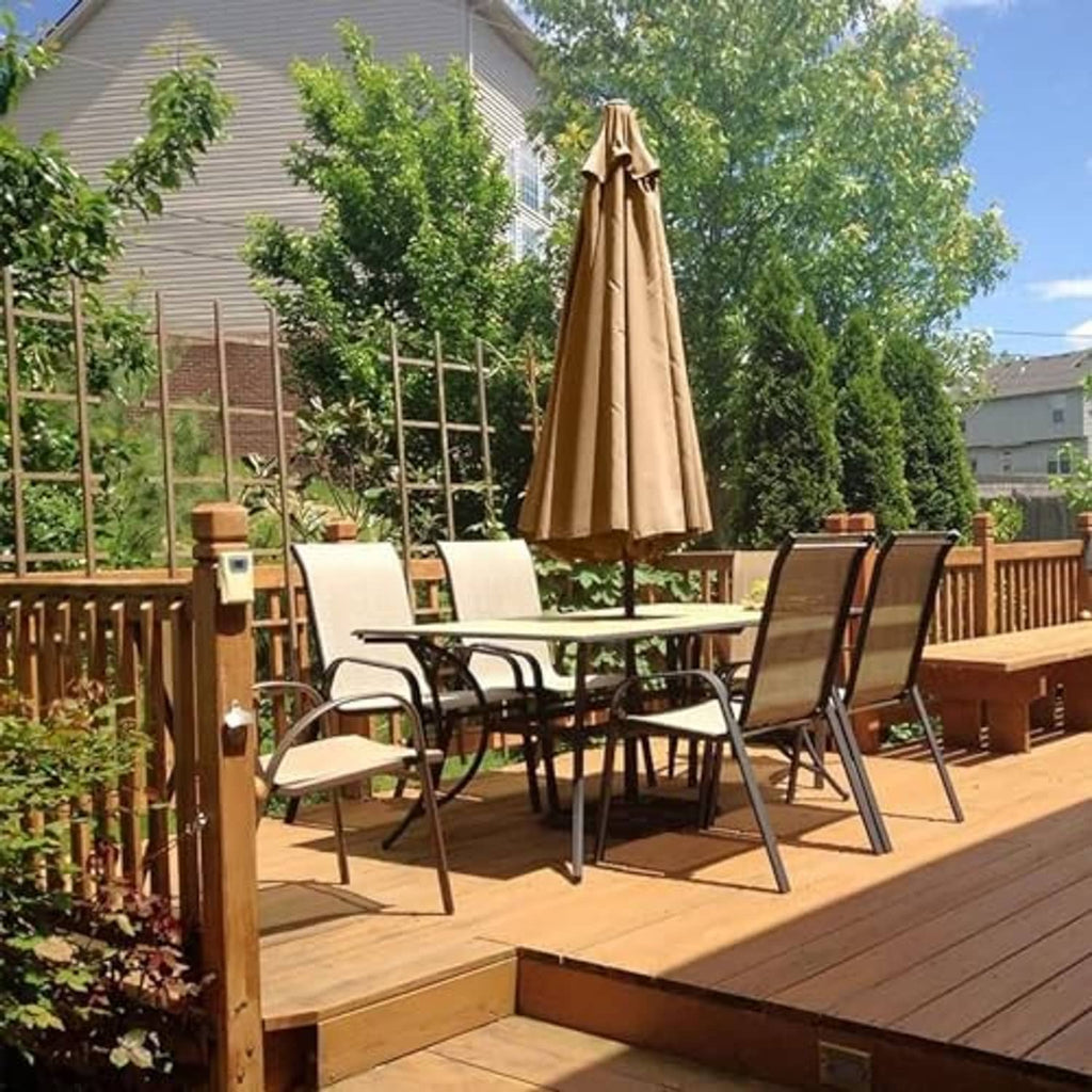 Beige patio umbrella canopy replacement above outdoor dining set