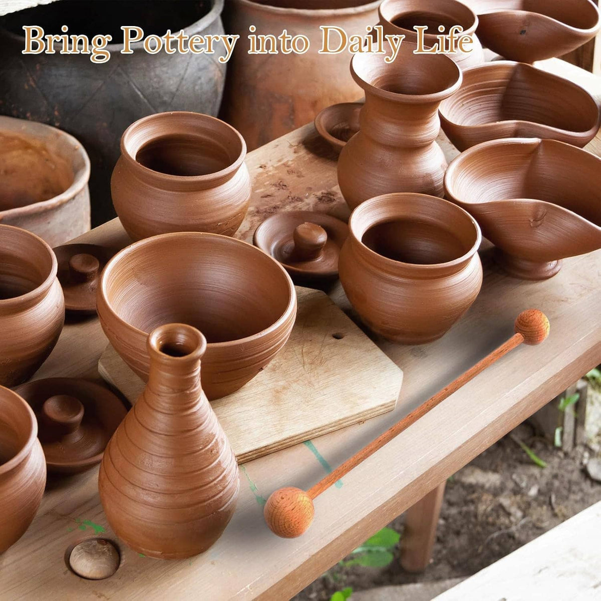 Pair of wooden pottery throwing sticks on a work board among clay vessels.