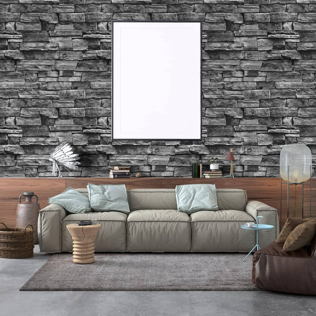 Dark gray stacked-brick wallpaper on a living room wall above a sofa.