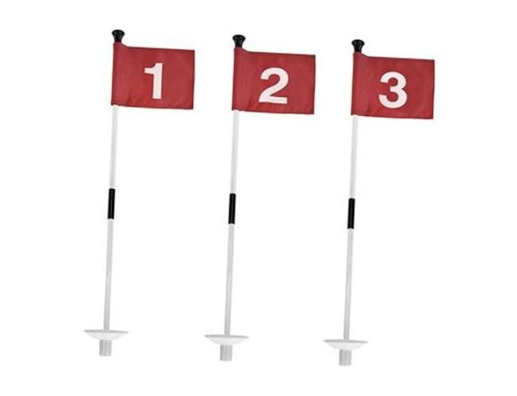 Red practice golf flags with numbered cloth markers on white poles and round bases