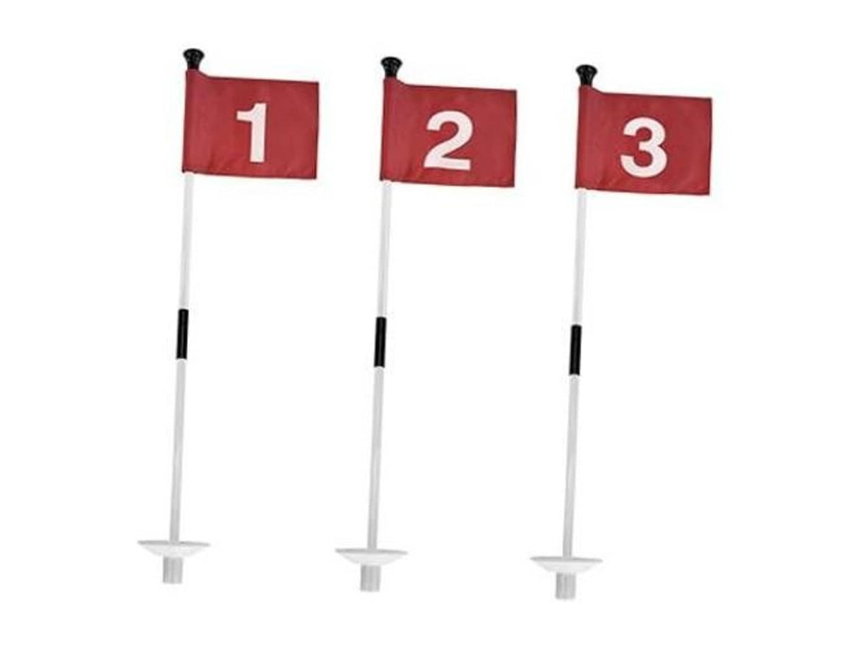 Red practice golf flags with numbered cloth markers on white poles and round bases