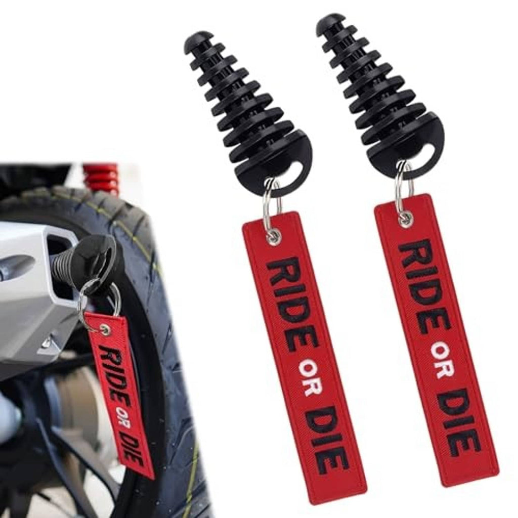 Pair of black exhaust wash plugs with red 'RIDE OR DIE' hanging tags and metal rings