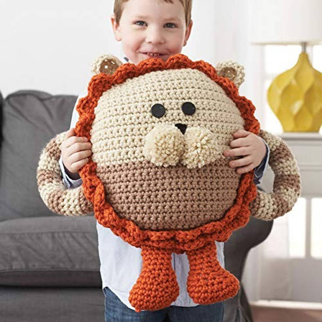 Crochet animal plush with tan face and orange hood