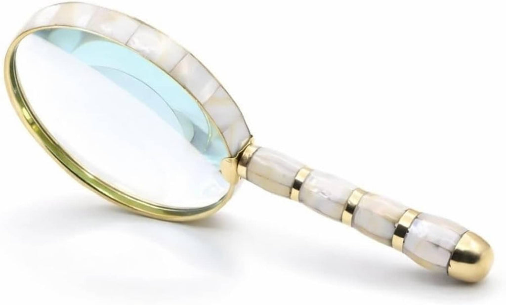 Mother-of-pearl magnifying glass with brass rim and pearl-striped handle