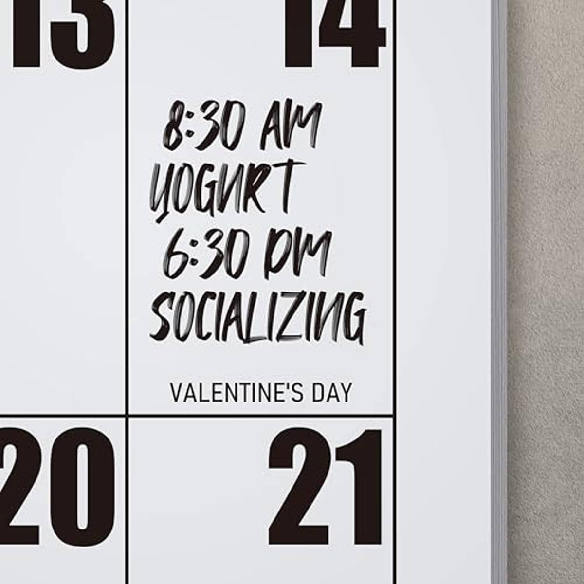 Calendar grid close-up with handwritten-style event text and day numbers