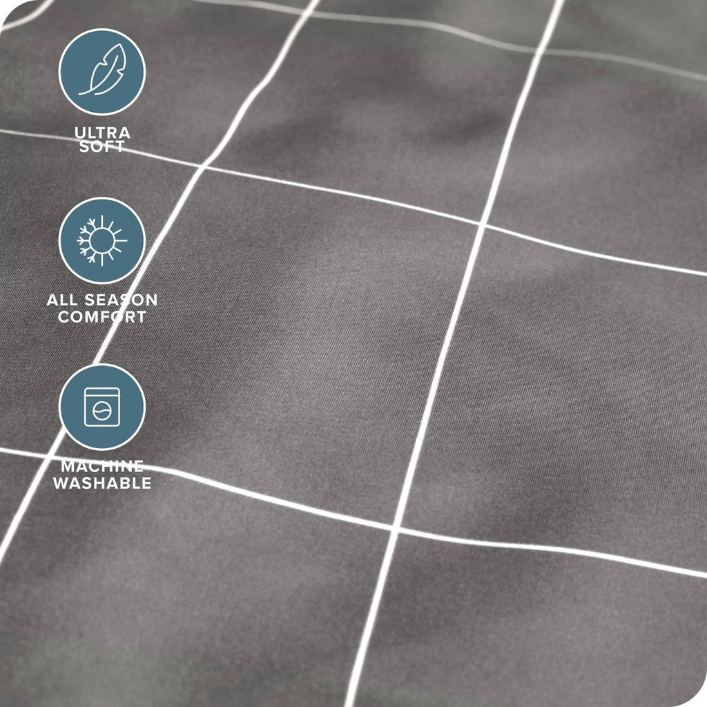 Close-up of grey fabric sheet with white grid lines and soft texture
