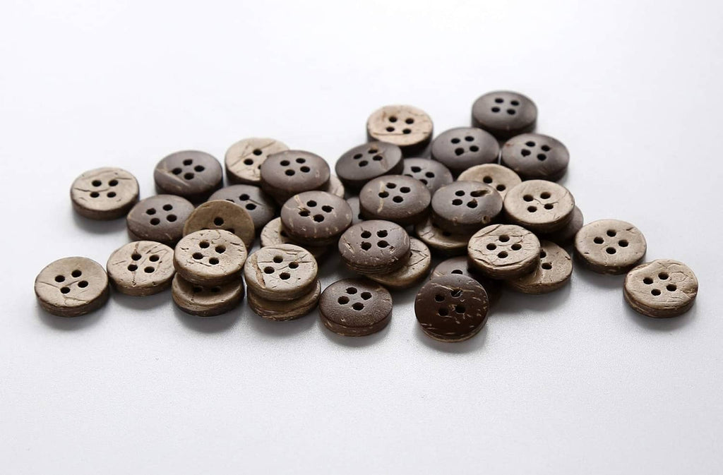 Assorted round coconut shell buttons with four holes, light and dark tones