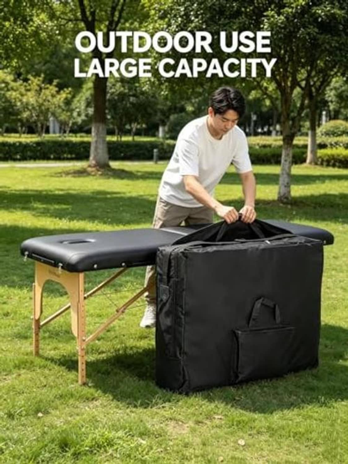 Black massage table storage bag with front pocket, outdoors near a folding table